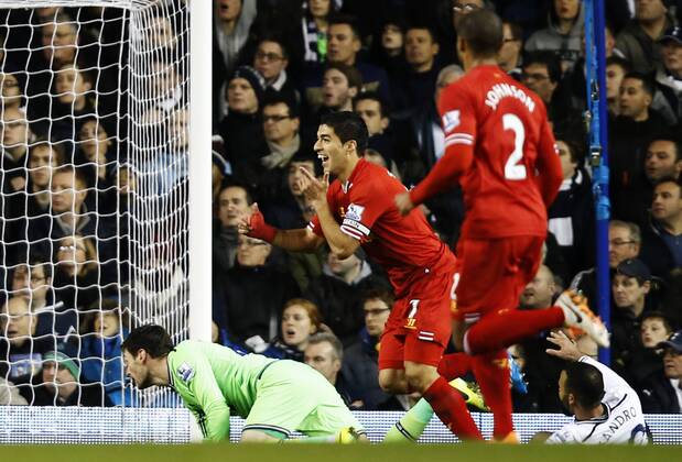 Luis Suarez of Liverpool celebrates scoring their first goal during the Barclays Premier League match between Tottenham Hotspur and Liverpool at White Hart Lane in London, Britain on Dec. 15, 2013. Liverpool won 5-0. (Xinhua Wang Lili) FOR EDITORIAL USE ONLY. NOT FOR SALE FOR MARKETING OR ADVERTISING CAMPAIGNS. NO USE WITH UNAUTHORIZED AUDIO, VIDEO, DATA, FIXTURE LISTS, CLUB LEAGUE LOGOS OR LIVE SERVICES. ONLINE IN-MATCH USE LIMITED TO 45 IMAGES, NO VIDEO EMULATION. NO USE IN BETTING, GAMES OR SINGLE CLUB LEAGUE PLAYER PUBLICATIONS. (SP)BRITAIN-LONDON-SOCCER-PREMIER LEAGUE-TOTTENHAM HOTSPUR VS LIVERPOOL