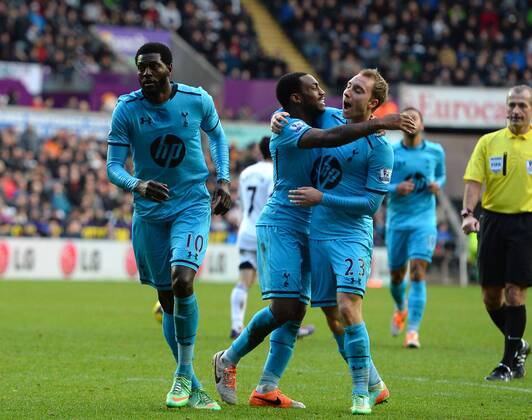 Emmanuel Adebayor of Tottenham celebrates his goal with Danny Rose and Christian Eriksen of Tottenham - Barclays Premier League - Swansea City vs Tottenham - Liberty Stadium - Swansea - Wales - 19th January 2014 - Picture Simon Bellis Sportimage EDITORIAL USE ONLY. No use with unauthorised audio, video, data, fixture lists, club league logos or live services. Online in-match use limited to 120 images, no video emulation. No use in betting, games or single club league player publications.