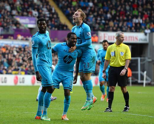 Emmanuel Adebayor of Tottenham celebrates his goal with Danny Rose and Christian Eriksen of Tottenham - Barclays Premier League - Swansea City vs Tottenham - Liberty Stadium - Swansea - Wales - 19th January 2014 - Picture Simon Bellis Sportimage EDITORIAL USE ONLY. No use with unauthorised audio, video, data, fixture lists, club league logos or live services. Online in-match use limited to 120 images, no video emulation. No use in betting, games or single club league player publications.