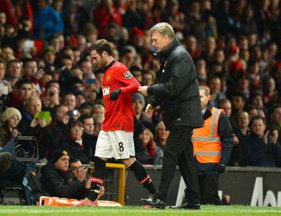 David Moyes manager of Manchester United congratulates Juan Mata of Manchester United as he is substituted - Barclays Premier League - Manchester United (ManU) vs Cardiff City - Old Trafford Stadium - Manchester - England - 28th January 2014 - EDITORIAL USE ONLY. No use with unauthorised audio, video, data, fixture lists, club league logos or live services. Online in-match use limited to 120 images, no video emulation. No use in betting, games or single club league player publications.