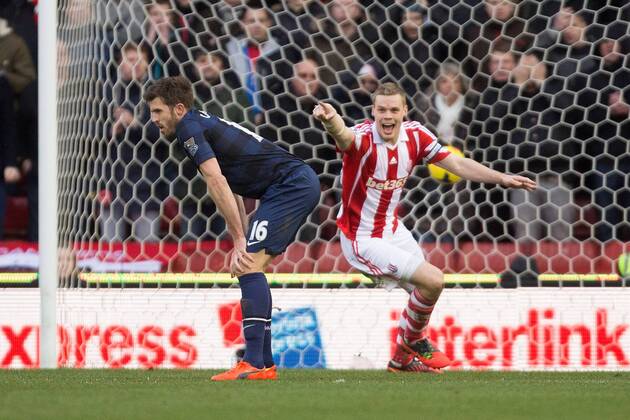 Michael Carrick of Manchester United (ManU) looks dejected as Stoke s Ryan Shawcross celebrates his sides opening goal - Stoke City vs. Manchester United (ManU) - Premier League - Britannia Stadium - Stoke - 01 02 2014 Pic PhilipxOldham Sportimage EDITORIAL USE ONLY. No use with unauthorised audio, video, data, fixture lists, club league logos or live services. Online in-match use limited to 120 images, no video emulation. No use in betting, games or single club league player publications.