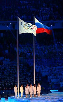 (140207) -- SOCHI, Feb. 7, 2014 (Xinhua) -- Olympic flag and Russia national flag flatter in the stadium during the opening ceremony for the 22nd Winter Olympic Games in Sochi, Russia, Feb. 7, 2014. (Xinhua Gong Bing) (SP)OLY-RUSSIA-SOCHI-OPENING CEREMONY 