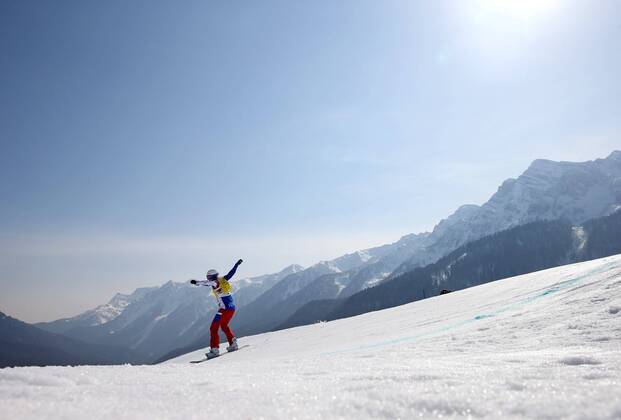Feb. 16, 2014 - Sochi, RUS - A snowboarder competes in quarterfinals of the women s snowboard cross at the Rosa Khutor Extreme Park during the Winter Olympics in Sochi, Russia, Sunday, Feb. 16, 2014. Women s Snowboard Cross - ZUMAm67