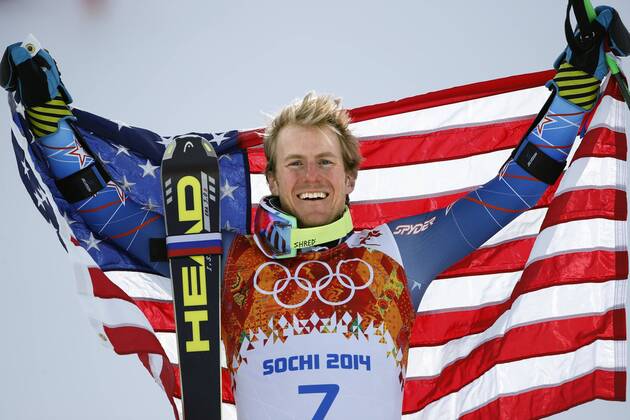 Feb. 19, 2014 - Sochi, Russia - TED LIGETY of the USA holds up the national flag during the flower ceremony after winning the gold medal at the Men s Giant Slalom Rosa Khutor Alpine Center at the 2014 Sochi Winter Olympics. Men s Alpine - Sochi 2014  - ZUMA- S