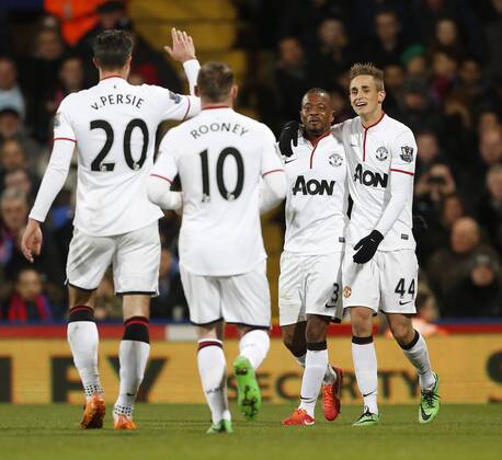 Manchester United s Wayne Rooney celebrates scoring his sides second goal with provider Patrice Evra Crystal Palace vs Manchester United - Premier League - Selhurst Park - London - England - 22 02 2014 - Pic David Klein Sportimage EDITORIAL USE ONLY. No use with unauthorised audio, video, data, fixture lists, club league logos or live services. Online in-match use limited to 120 images, no video emulation. No use in betting, games or single club league player publications.