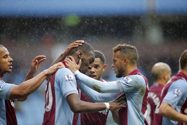Christian Benteke of Aston Villa celebrates scoring the second goal of the game for his side with Ryan Bertrand (right) - Footballl - Barclays Premier League - Aston Villa vs Norwich City - Villa Park Birmingham - Season 2013 14 - 2nd March 2014 EDITORIAL USE ONLY. No use with unauthorised audio, video, data, fixture lists, club league logos or live services. Online in-match use limited to 120 images, no video emulation. No use in betting, games or single club league player publications.
