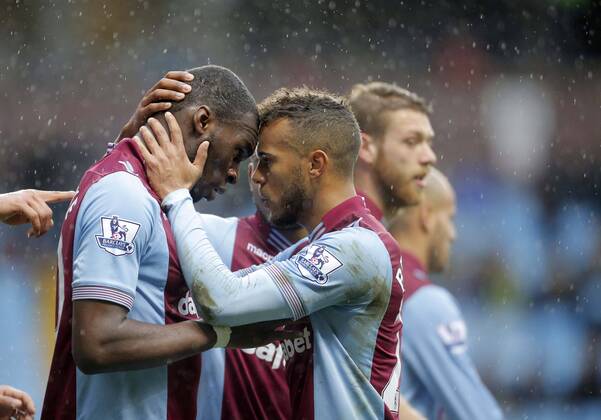 Christian Benteke of Aston Villa celebrates scoring the second goal of the game for his side with Ryan Bertrand (right) - Footballl - Barclays Premier League - Aston Villa vs Norwich City - Villa Park Birmingham - Season 2013 14 - 2nd March 2014 EDITORIAL USE ONLY. No use with unauthorised audio, video, data, fixture lists, club league logos or live services. Online in-match use limited to 120 images, no video emulation. No use in betting, games or single club league player publications.
