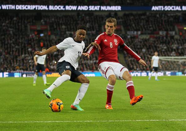 England s Raheem Sterling tussles with Denmark s Jakob Poulsen England v Denmark - International Friendly - Wembley Stadium in London - London - England - 05 03 2014 - EDITORIAL USE ONLY. No use with unauthorised audio, video, data, fixture lists, club league logos or live services. Online in-match use limited to 120 images, no video emulation. No use in betting, games or single club league player publications.