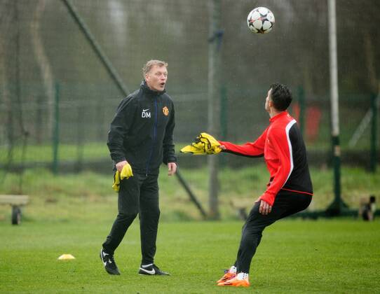 David Moyes, manager of Manchester United chips the ball over Robin van Persie during training - UEFA Champions League - Manchester United Training - Aon Carrington Training Complex - Manchester - England - 18th March 2014 - Picture Philip Oldham Sportimage EDITORIAL USE ONLY. No use with unauthorised audio, video, data, fixture lists, club league logos or live services. Online in-match use limited to 120 images, no video emulation. No use in betting, games or single club league player publications.