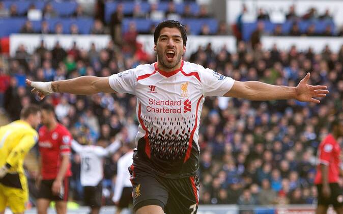 Luis Suarez of Liverpool celebrates scoring his sides fourth goal - Barclays Premier League - Cardiff City vs. FC Liverpool - Cardiff City Stadium - Cardiff - Wales - 22nd March 2014 - EDITORIAL USE ONLY. No use with unauthorised audio, video, data, fixture lists, club league logos or live services. Online in-match use limited to 120 images, no video emulation. No use in betting, games or single club league player publications.