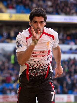 Luis Suarez of Liverpool celebrates scoring his sides sixth goal - Barclays Premier League - Cardiff City vs. FC Liverpool - Cardiff City Stadium - Cardiff - Wales - 22nd March 2014 - EDITORIAL USE ONLY. No use with unauthorised audio, video, data, fixture lists, club league logos or live services. Online in-match use limited to 120 images, no video emulation. No use in betting, games or single club league player publications.
