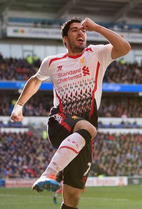 Luis Suarez of Liverpool celebrates scoring his sides fourth goal - Barclays Premier League - Cardiff City vs. FC Liverpool - Cardiff City Stadium - Cardiff - Wales - 22nd March 2014 - EDITORIAL USE ONLY. No use with unauthorised audio, video, data, fixture lists, club league logos or live services. Online in-match use limited to 120 images, no video emulation. No use in betting, games or single club league player publications.