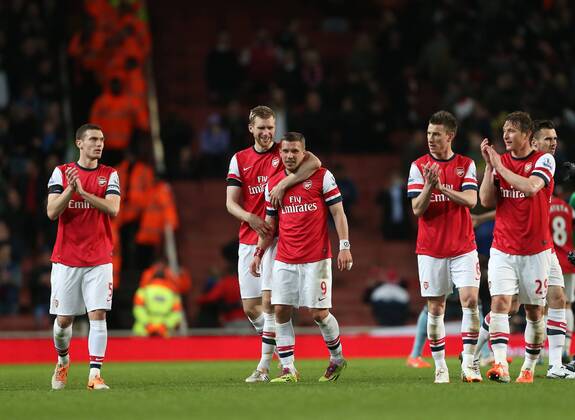 Arsenal s Lukas Podolski celebrates at the final whistle with Per Mertesacker Arsenal vs West Ham United- Barclays Premier League - Emirates Stadium - London - England - 15 04 2014 - Pic David Klein Sportimage EDITORIAL USE ONLY. No use with unauthorised audio, video, data, fixture lists, club league logos or live services. Online in-match use limited to 120 images, no video emulation. No use in betting, games or single club league player publications.