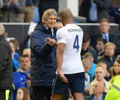 Manuel Pellegrini manager of Manchester City celebrates with his captain Vincent Kompany of Manchester City - Barclays Premier League - Everton v Manchester City - Goodison Park Stadium - Liverpool - England - 3rd May 2014 - Pic Simon Bellis Sportimage EDITORIAL USE ONLY. No use with unauthorised audio, video, data, fixture lists, club league logos or live services. Online in-match use limited to 120 images, no video emulation. No use in betting, games or single club league player publications.
