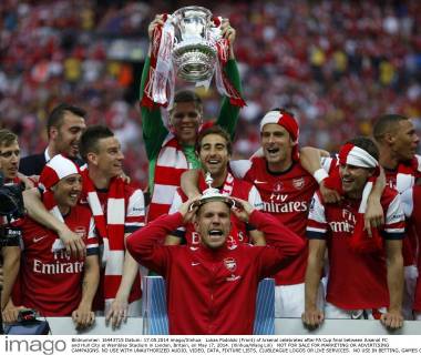 Lukas Podolski (Front) of Arsenal celebrates after FA Cup final between Arsenal FC and Hull City at Wembley Stadium in London, Britain, on May 17, 2014. (Xinhua Wang Lili) NOT FOR SALE FOR MARKETING OR ADVERTISING CAMPAIGNS. NO USE WITH UNAUTHORIZED AUDIO, VIDEO, DATA, FIXTURE LISTS, CLUBLEAGUE LOGOS OR LIVE SERVICES. NO USE IN BETTING, GAMES OR SINGLE CLUBLEAGUEPLAYER PUBLICATIONS. (SP)BRITAIN-LONDON-SOCCER-FA CUP-FINAL-ARSENAL VS HULL CITY 