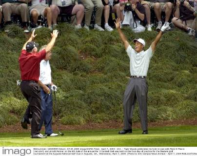 April 7, 2004 - U.S. - Tiger Woods celebrates his hole-in-one with Mark O Meara (red shirt) and Arnold Palmer on the 9th hole of the annual Par 3 Contest that was held on the final day of practice for the Masters golf tournament at the Augusta National Golf Club in Augusta, GA., Wednesday, April 7, 2004. (Photo by Erik Campos News Archive - April 7, 2004 - ZUMAm67