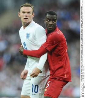 Football - 2014 International Friendly - England vs. Peru England s Wayne Rooney is grabbed by Peru s Christian Ramos at Wembley. COLORSPORT ANDREW COWIE 