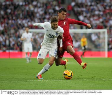 England s Adam Lallana tussles with Peru s Rinaldo Callens England v Peru - International Friendly - Wembley Stadium- London - England - 30 05 2014 - Pic David Klein Sportimage EDITORIAL USE ONLY. No use with unauthorised audio, video, data, fixture lists, club league logos or live services. Online in-match use limited to 120 images, no video emulation. No use in betting, games or single club league player publications.