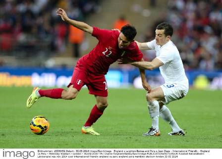 England s Leighton Baines and Peru s Jean Deza - International Friendly - England vs Peru - Wembley Stadium - London - 30 05 2014 - Pic Charlie Forgham-Bailey Sportimage EDITORIAL USE ONLY. No use with unauthorised audio, video, data, fixture lists, club league logos or live services. Online in-match use limited to 120 images, no video emulation. No use in betting, games or single club league player publications.