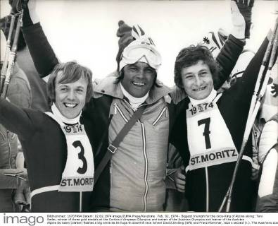 Feb. 02, 1974 - Biggest triumph for the once-King of Alpine skiing: Toni Sailer, winner of three gold medals at the Cortina d Ampezzo Olympics and trainer of the Austrian Olympics and trainer of the Austrian Alpine ski team (center) flashes a big smile as he hugs th downhill race winner David Zwilling (left) and Franz Klammer, race s second (r.). The Austrains scored their biggest triumph at the 23rd Alpine Ski World Championships here by winning one two the most important of all races.  - ZUMAk09