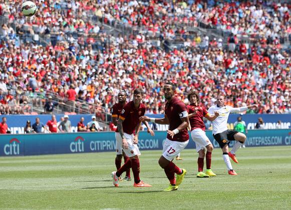 Manchester United s Wayne Rooney scoring his sides opening goal - International Champions Cup 2014 - AS Roma v Manchester United - Sports Authority Field - Denver - USA - 26th July 2014 - Picture David Klein Sportimage EDITORIAL USE ONLY. No use with unauthorised audio, video, data, fixture lists, club league logos or live services. Online in-match use limited to 120 images, no video emulation. No use in betting, games or single club league player publications.