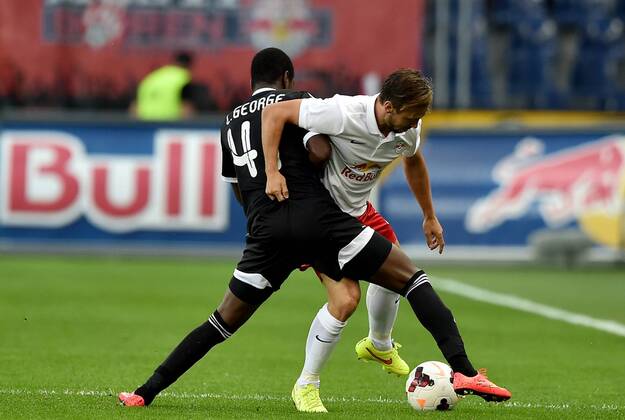 SOCCER - CL, RBS vs Qarabag SALZBURG,AUSTRIA,06.AUG.14 - SOCCER - UEFA Champions League, qualifying, Red Bull Salzburg vs Qarabag Agdam FK. Image shows Leroy George (Qarabag) and Andreas Ulmer (RBS).