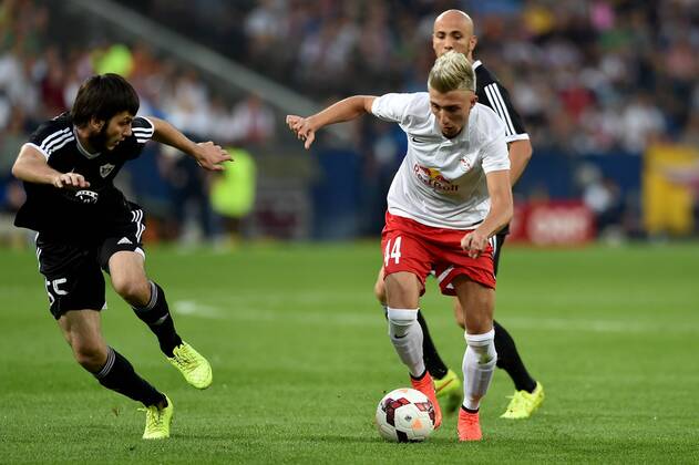 SOCCER - CL, RBS vs Qarabag SALZBURG,AUSTRIA,06.AUG.14 - SOCCER - UEFA Champions League, qualifying, Red Bull Salzburg vs Qarabag Agdam FK. Image shows Badavi Guseynov (Qarabag) and Kevin Kampl (RBS).