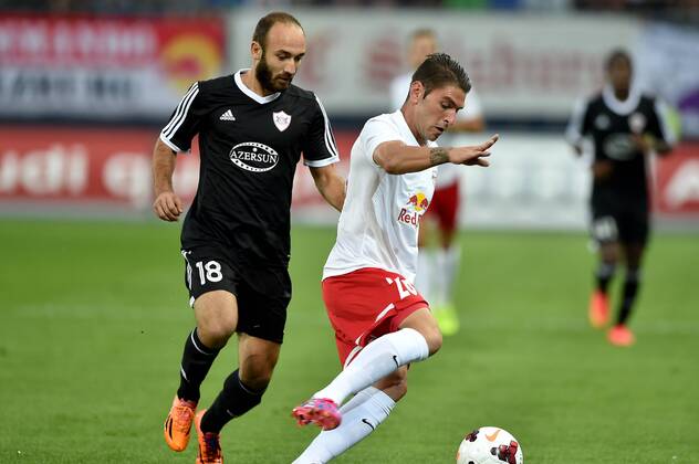 SOCCER - CL, RBS vs Qarabag SALZBURG,AUSTRIA,06.AUG.14 - SOCCER - UEFA Champions League, qualifying, Red Bull Salzburg vs Qarabag Agdam FK. Image shows Ilgar Gurbanov (Qarabag) and Jonatan Soriano (RBS).