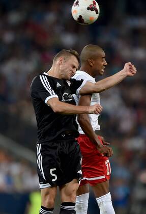 SOCCER - CL, RBS vs Qarabag SALZBURG,AUSTRIA,06.AUG.14 - SOCCER - UEFA Champions League, qualifying, Red Bull Salzburg vs Qarabag Agdam FK. Image shows Maksim Medvedev (Qarabag) and Alan de Carvalho (RBS).