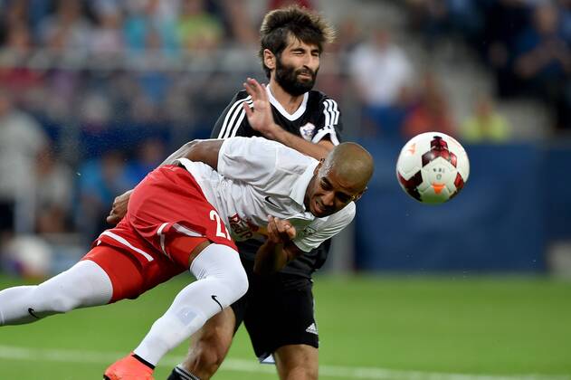 SOCCER - CL, RBS vs Qarabag SALZBURG,AUSTRIA,06.AUG.14 - SOCCER - UEFA Champions League, qualifying, Red Bull Salzburg vs Qarabag Agdam FK. Image shows Alan de Carvalho (RBS) and Rashad Sadygov (Qarabag).