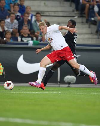SOCCER - CL, RBS vs Qarabag SALZBURG,AUSTRIA,06.AUG.14 - SOCCER - UEFA Champions League, qualifying, Red Bull Salzburg vs Qarabag Agdam FK. Image shows Martin Hinteregger (RBS) and Leroy George (Qarabag).