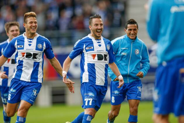 20140817 - GENT, BELGIUM: Gent s Danijel Milicevic (C) celebrates with his teammates after scoring during the Jupiler Pro League match between KAA Gent and Zulte Waregem, in Gent, Sunday 17 August 2014, on day 4 of the Belgian soccer championship. BRUNOxFAHY  04280117