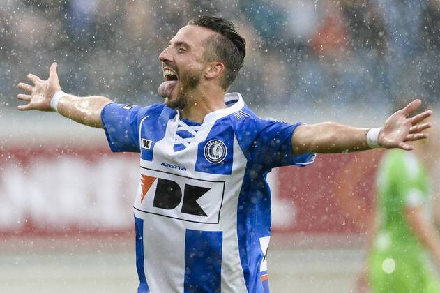 20140817 - GENT, BELGIUM: Gent s Danijel Milicevic celebrates after scoring during the Jupiler Pro League match between KAA Gent and Zulte Waregem, in Gent, Sunday 17 August 2014, on day 4 of the Belgian soccer championship. LAURIExDIEFFEMBACQ  04280373