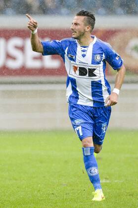 20140817 - GENT, BELGIUM: Gent s Danijel Milicevic celebrates after scoring during the Jupiler Pro League match between KAA Gent and Zulte Waregem, in Gent, Sunday 17 August 2014, on day 4 of the Belgian soccer championship. LAURIExDIEFFEMBACQ  04280380