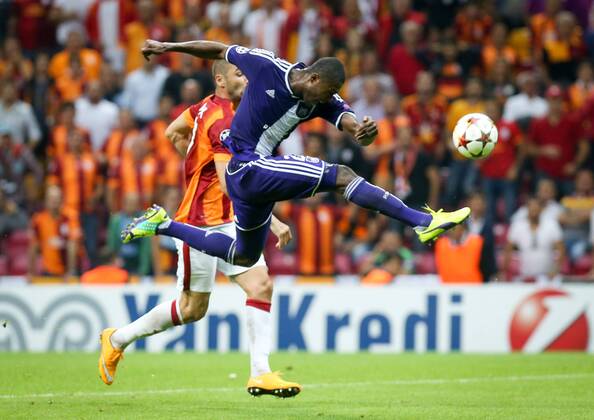 ISTANBUL - Galatasaray s Burak Yilmaz and Anderlecht s Chancel Mbemba fight for the ball during a soccer game between Turkish team Galatasaray S.K. and Belgian team RSC Anderlecht in the Tuk Telekom Arena in Istanbul, Turkey, Tuesday 16 September 2014, on day 1 of the group stage of the UEFA Champions League competition, in group D. VIRGINIExLEFOUR  premiumd Highlight 04316876