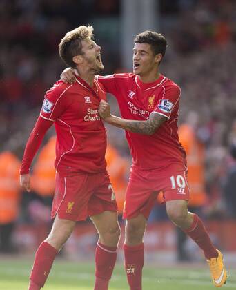 Adam Lallana of Liverpool celebrates his opening goal - FC Liverpool vs. West Bromwich Albion - Barclay s Premier League - Anfield - Liverpool - 04 10 2014 EDITORIAL USE ONLY. No use with unauthorised audio, video, data, fixture lists, club league logos or live services. Online in-match use limited to 120 images, no video emulation. No use in betting, games or single club league player publications.
