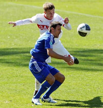 VfB Stuttgart II 01.04.2012, Fussball 3. Liga, VfB Stuttgart II- FC Carl Zeiss Jena (3:0): Thomas Geyer (VfB Stuttgart II), Alban Ramaj (FC Carl Zeiss Jena).