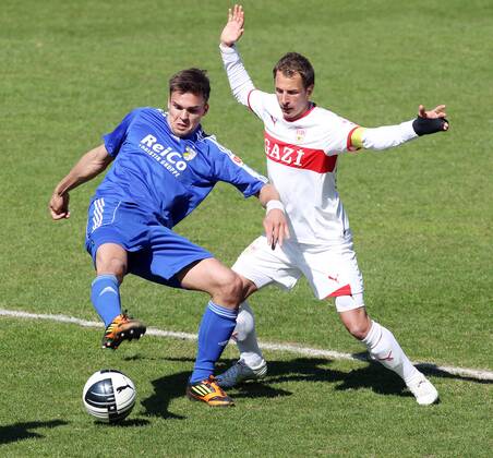 VfB Stuttgart II 01.04.2012, Fussball 3. Liga, VfB Stuttgart II- FC Carl Zeiss Jena (3:0): Nils Pichinot (FC Carl Zeiss Jena), Tobias Rathgeb (VfB Stuttgart II).