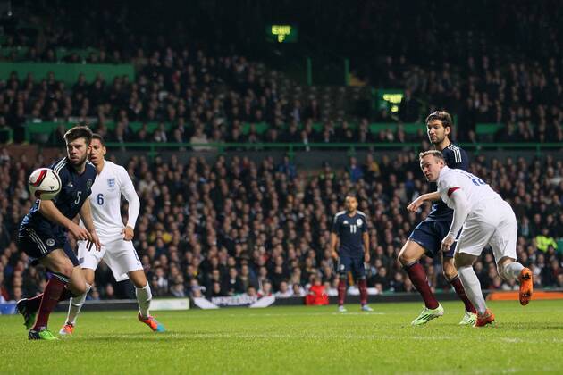 England s Wayne Rooney scoring his sides second goal - International Friendly - Scotland vs England- Celtic Park - Glasgow - Scotland - 18th November 2014 - Picture David Klein Sportimage EDITORIAL USE ONLY. No use with unauthorised audio, video, data, fixture lists, club league logos or live services. Online in-match use limited to 120 images, no video emulation. No use in betting, games or single club league player publications.