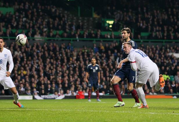 England s Wayne Rooney scoring his sides second goal - International Friendly - Scotland vs England- Celtic Park - Glasgow - Scotland - 18th November 2014 - Picture David Klein Sportimage EDITORIAL USE ONLY. No use with unauthorised audio, video, data, fixture lists, club league logos or live services. Online in-match use limited to 120 images, no video emulation. No use in betting, games or single club league player publications.