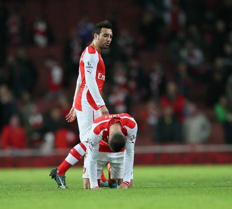 Arsenal s Kieran Gibbs looks on dejected at the final whistle as Santi Cazorla walks past Barclays Premier League- Arsenal vs Manchester United - Emirates Stadium - England - 22nd November 2014 - Picture David Klein Sportimage EDITORIAL USE ONLY. No use with unauthorised audio, video, data, fixture lists, club league logos or live services. Online in-match use limited to 120 images, no video emulation. No use in betting, games or single club league player publications.