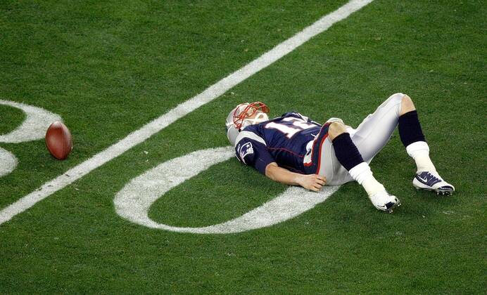 Feb. 3, 2008 - New England Patriots quarterback Tom Brady lays on the field after being sacked in the third qurter of Super Bowl XLII at University of Phoenix Stadium in Glendale, Arizona, on Sunday, February 3, 2008. (Jim Prisching MCT) News Archive - Feb. 3, 2008 - ZUMAm67_