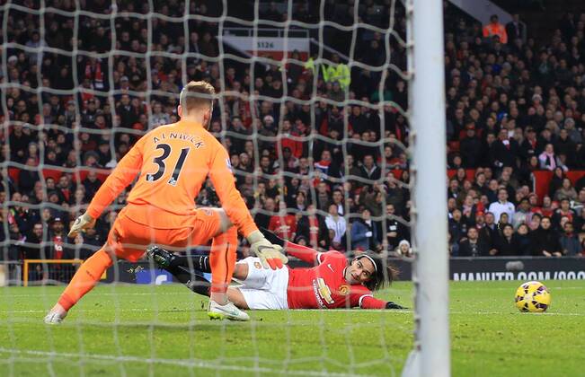 Manchester United ManU s Radamel Falcao setting up his sides opening goal Barclays Premier League - Manchester United vs Newcastle United - Old Trafford - England - 26th December 2014 - Picture David Klein Sportimage EDITORIAL USE ONLY. No use with unauthorised audio, video, data, fixture lists, club league logos or live services. Online in-match use limited to 120 images, no video emulation. No use in betting, games or single club league player publications.
