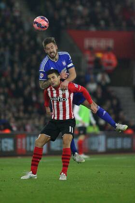 Football - 2014 2015 FA Cup - Third Round: Southampton vs. Ipswich Town Luke Chambers of Ipswich Town climbs all over Southampton s Dusan Tadic to win a header at St Mary s Stadium Southampton Colorsport Shaun Boggust 