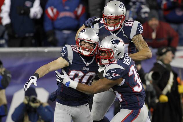 New England Patriots wide receiver Brian Tyms (84) and running back Shane Vereen (34) congratulate wide receiver Danny Amendola (80) after his 51-yard touchdown reception by on an option pass in the third quarter of the AFC Divisional Playoff game against the Baltimore Ravens at Gillette Stadium in Foxborough, Massachusetts on January 10, 2015. The Patriots defeated the Ravens 35-31. Photo by Matthew Healey UPI  BOS2015011015 MATTHEWxHEALEY