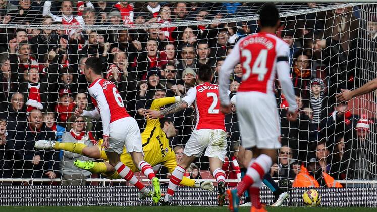 Football - 2014 2015 - Barclays Premier League, - Arsenal Vs Stoke City, Arsenal s Laurent Koscielny beats Stoke City s Asmir Begovic with a header to open the scoring at The Emirates Stadium COLORSPORT DANIEL BEARHAM ARS_STO
