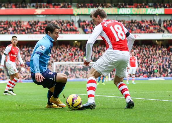 Football - 2014 2015 - Barclays Premier League, - Arsenal Vs Stoke City, Stoke City s Bojan Krkic cuts inside Arsenal s Nacho Monreal at The Emirates Stadium COLORSPORT DANIEL BEARHAM ARS_STO