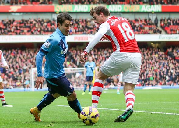 Football - 2014 2015 - Barclays Premier League, - Arsenal Vs Stoke City, Stoke City s Bojan Krkic cuts inside Arsenal s Nacho Monreal at The Emirates Stadium COLORSPORT DANIEL BEARHAM ARS_STO