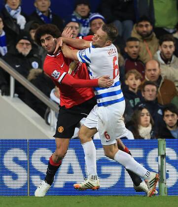 QPR s Clint Hill tussles with Manchester United ManU s Marouane Fellaini Barclays Premier League - Queens Park Rangers vs Manchester United - Loftus Road - England - 17th January 2015 - Picture David Klein Sportimage EDITORIAL USE ONLY. No use with unauthorised audio, video, data, fixture lists, club league logos or live services. Online in-match use limited to 120 images, no video emulation. No use in betting, games or single club league player publications.