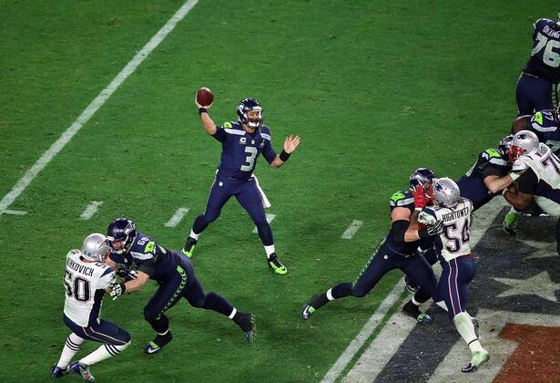 01 February 2015: Seattle Seahawks quarterback Russell Wilson 3 throws a pass during the second half of Super Bowl XLIX between the Seattle Seahawks and the New England Patriots at University of Phoenix Stadium in Glendale, Az. The New England Patriots beat the Seattle Seahawks 28-24. NFL American Football Herren USA FEB 01 Super Bowl XLIX - Patriots v Seahawks Icon3171502013096 EDITORIAL USE ONLY